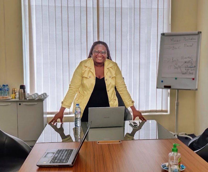 A Virtual Domain facilitator leading a strategy session beside a flipchart